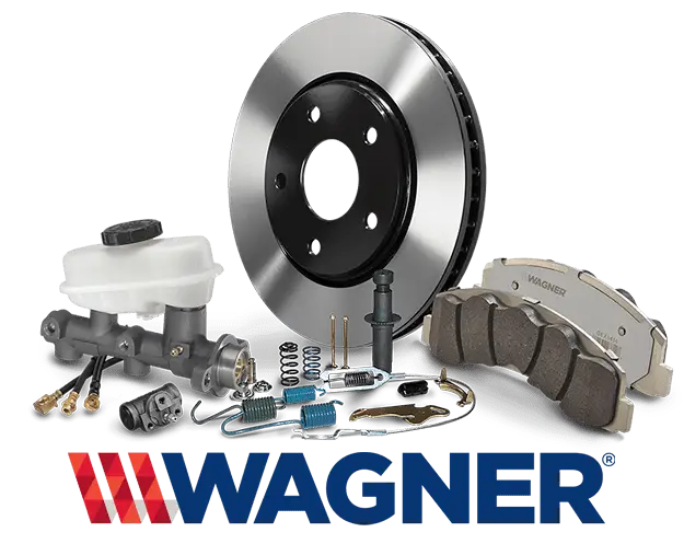 The Mufflerman, Mechanic Near Me A collection of automotive brake components, including a brake disc, brake pads, a master cylinder, and various small parts. The word Wagner is prominently displayed at the bottom in blue with a red and white logo. Perfect for anyone searching for Brake Pad Replacement Near Me.