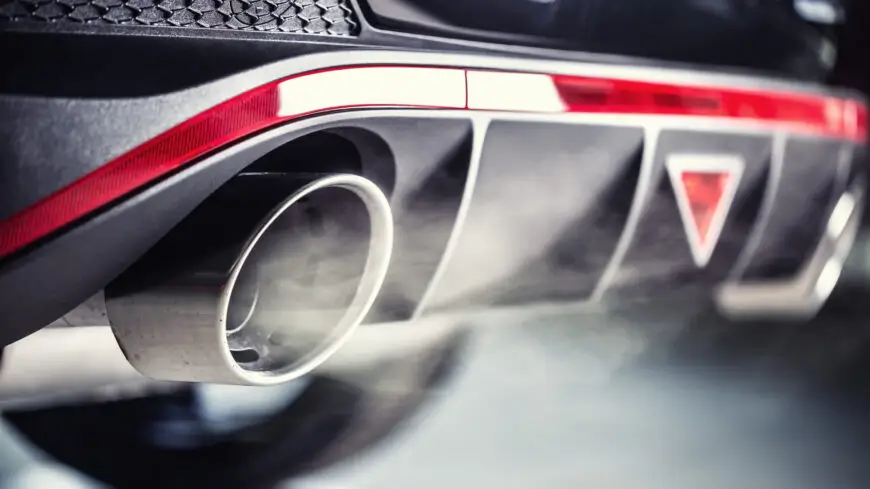 Technician checking an exhaust leak after an exhaust smell inside your car