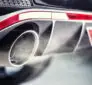 Technician checking an exhaust leak after an exhaust smell inside your car